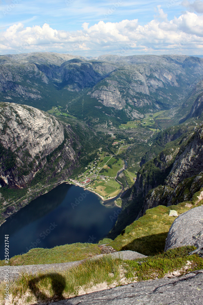 Hiking in the highlands along Lysefjord, on the way to Kjeragbolten with view on the fjord and Lysebotn in Rogaland region, Norway
