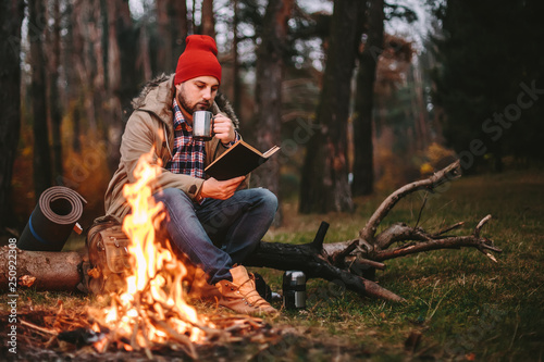 Young blogger photographer travel in mountain forest