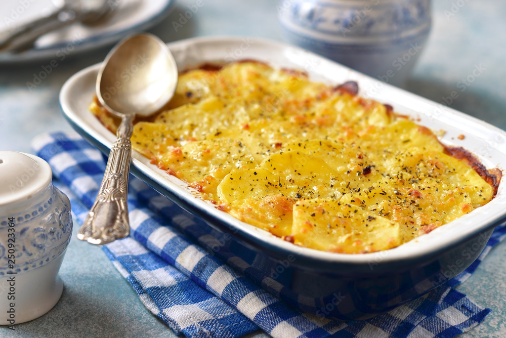 Potato celery gratin with cheese. Stock Photo Adobe Stock