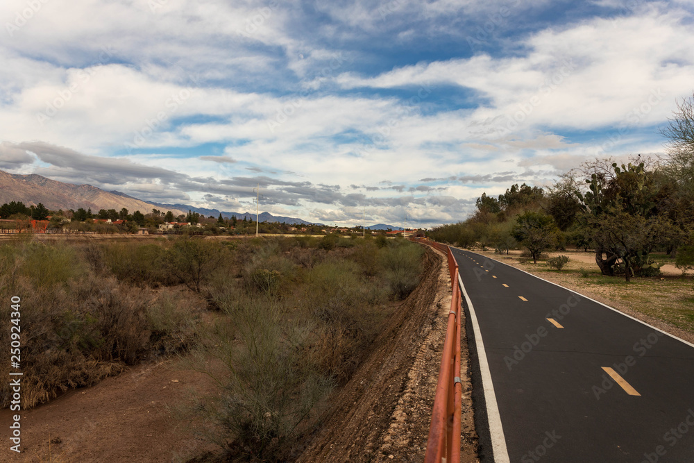 Empty bike and running path along Tucson's Rillito River on beautiful day