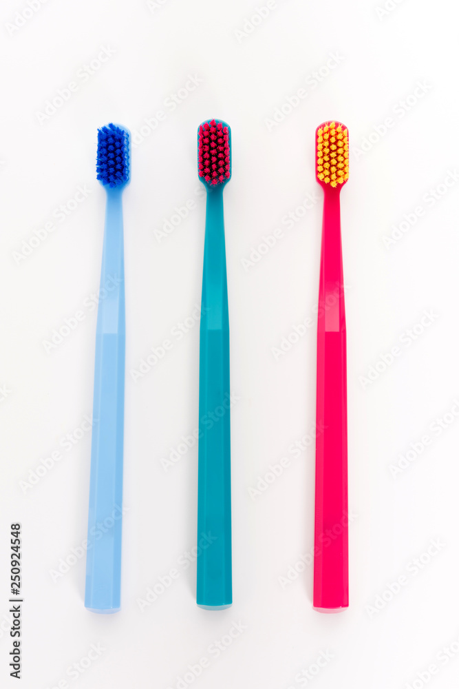 Three tooth brushes. Isolated on white background