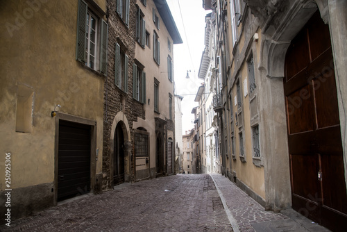 Street of the old city of Bergamo . Italy .