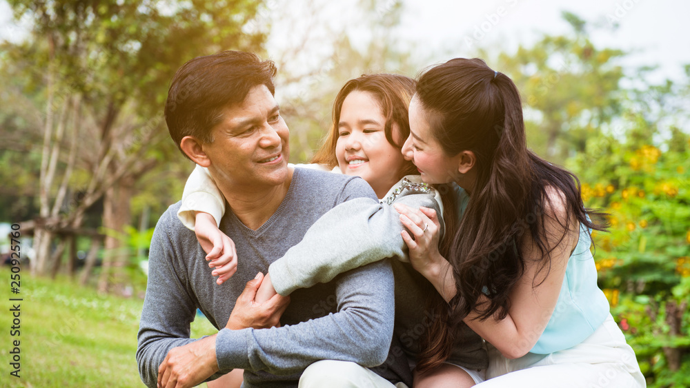 Fototapeta premium Happy children with parents relax in the park
