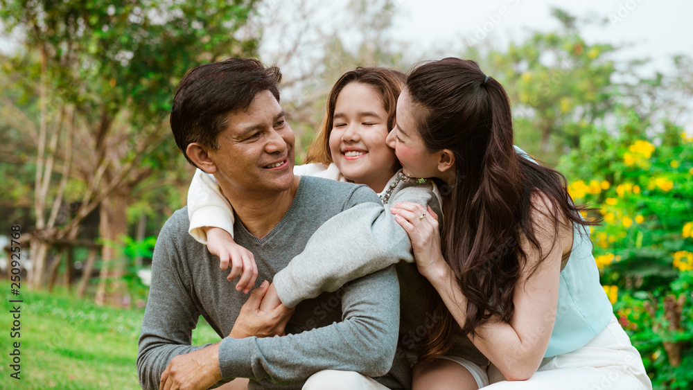 Happy family relaxation in the park Happy family relaxation in the park