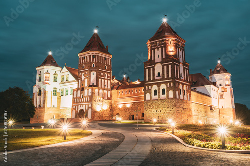 Mir, Belarus. Mir Castle Complex In Evening Night Illumination Lighting. Famous Landmark. UNESCO Heritage. Architectural And Cultural Heritage.