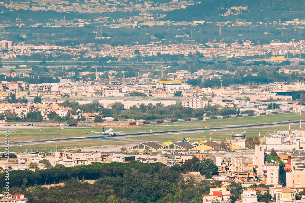 Naples, Italy. Plane Is Landing Or Taking Off At Naples International Airport
