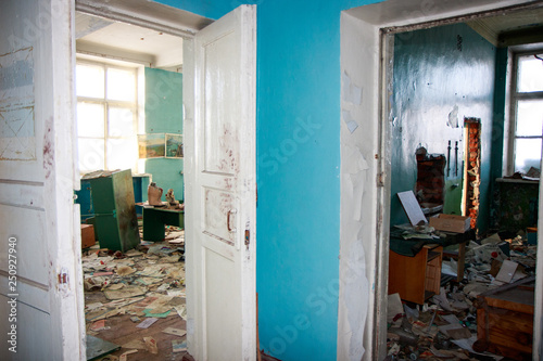Old school building interiors inside, abandoned soviet union house. Vintage grunge retro oldish urban past times style. Windows and doors in corridor, destructed, abandoned no people inside