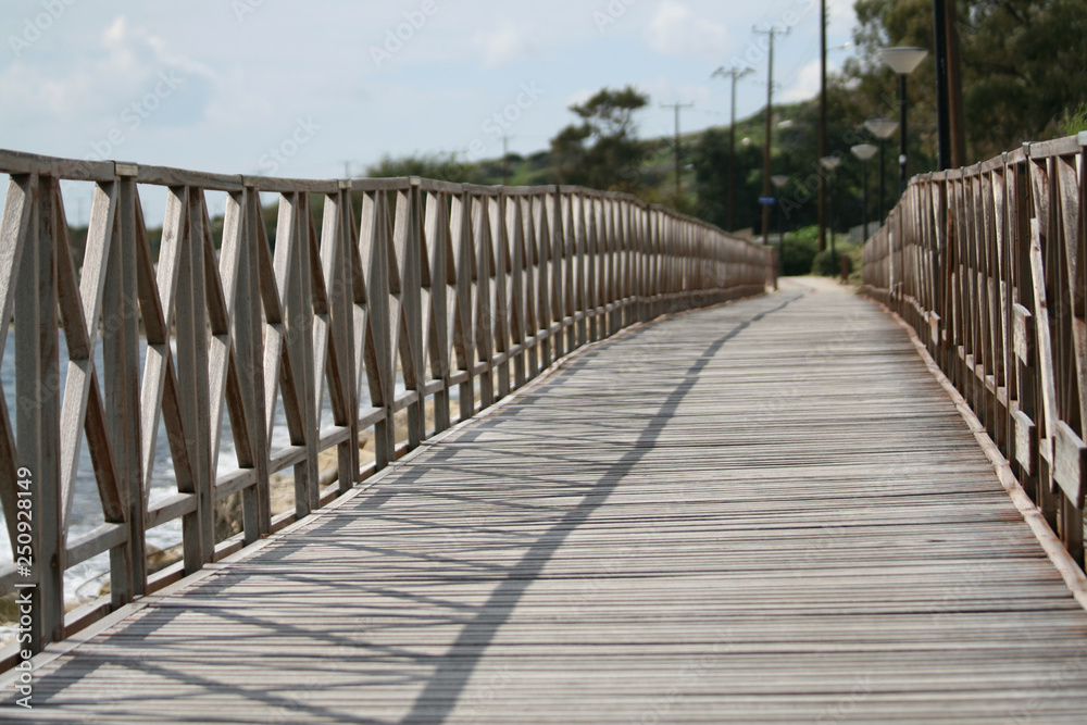 Wooden footbridge by the sea Wooden footbridge by the sea