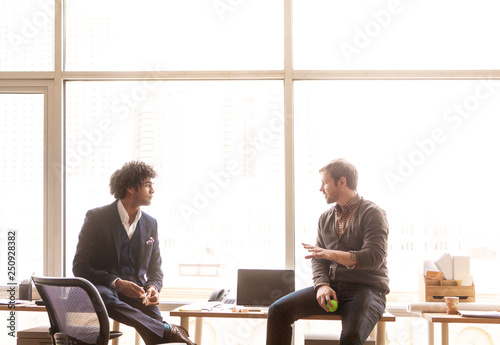 Office workers discussing in office 