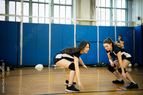 Volleyball players in sports hall  photo