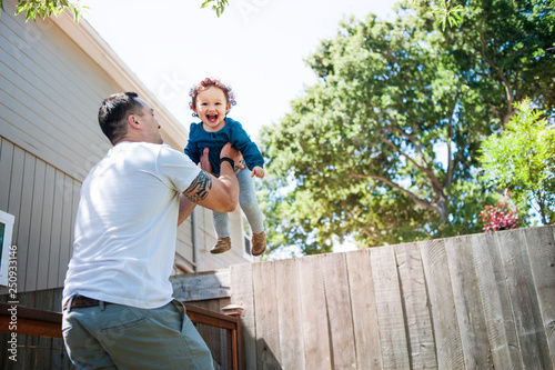 Baby girl (12-17 months) playing with father 
