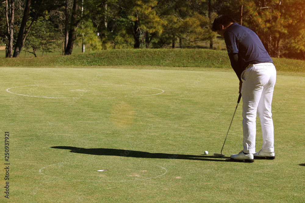 Fototapeta premium Blurred golfers are putting golf in the evening golf course in Thailand