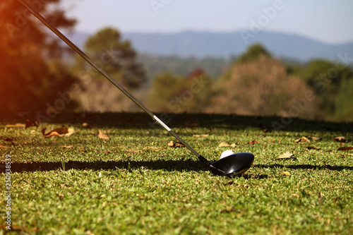 Golf club and golf ball close up in golf coures at Thailand