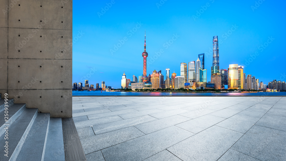 Empty square floor with panoramic city skyline in shanghai at night,China Empty square floor with panoramic city skyline in shanghai at night,China