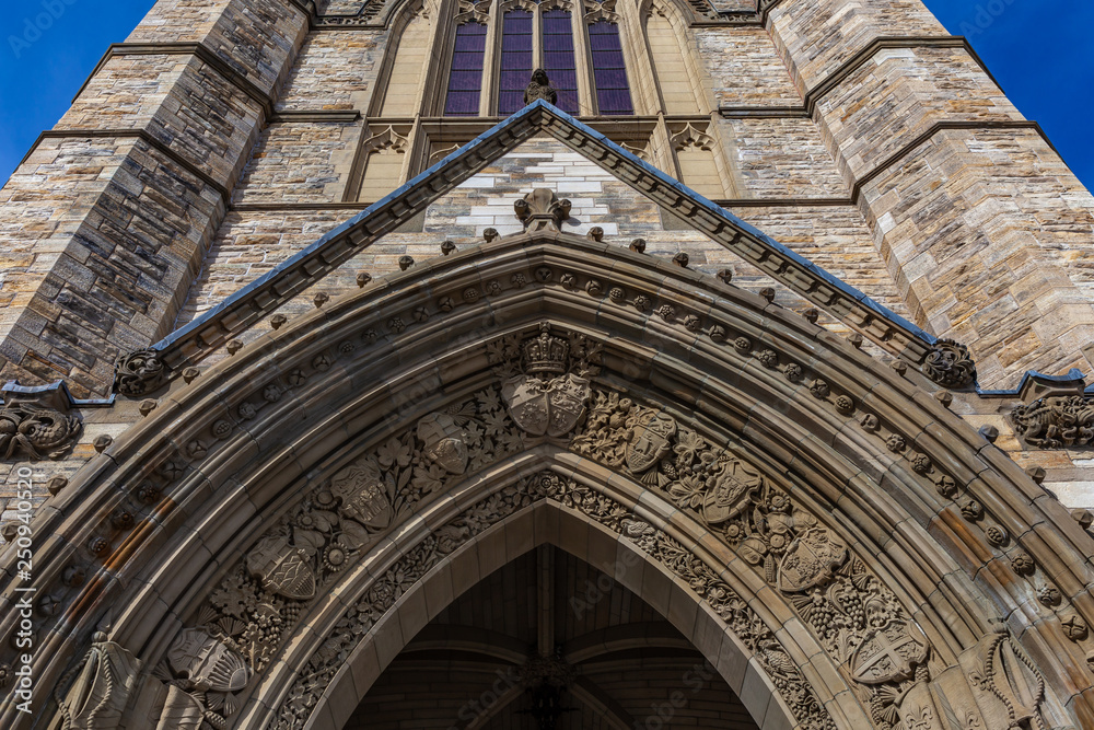 Ottawa CANADA - February 17, 2019: Architecture Details and heraldic insignia on Federal Parliament Building of Canada in Ottawa, North America Ottawa CANADA - February 17, 2019: Architecture Details and heraldic insignia on Federal Parliament Building of Canada in Ottawa, North America