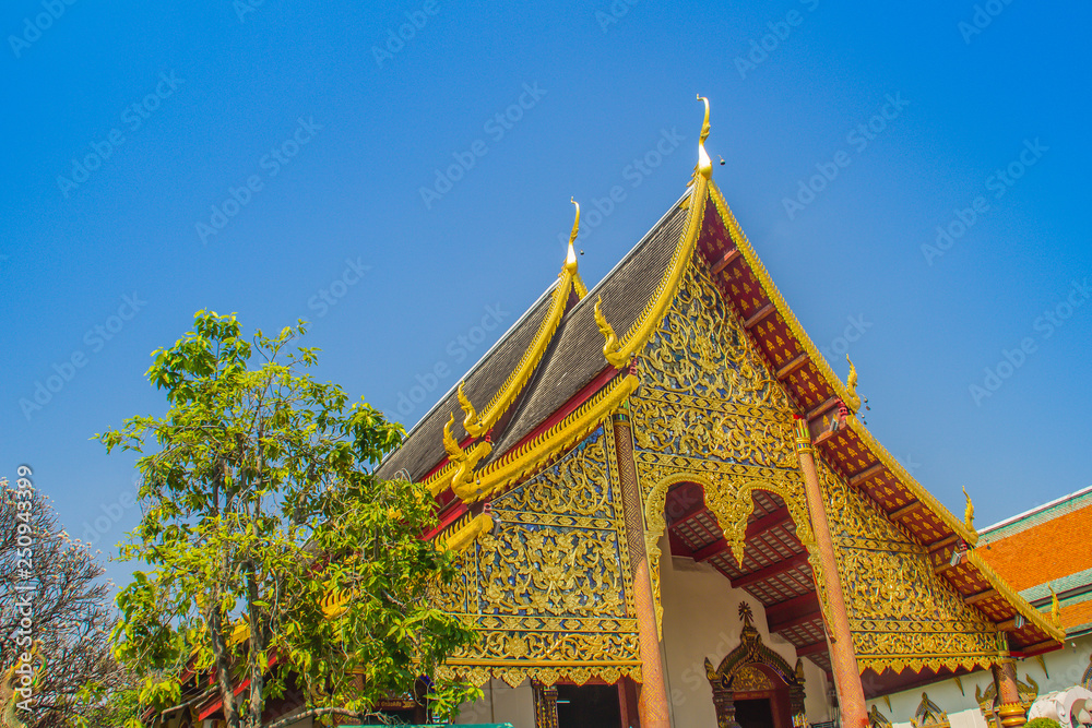 Beautiful golden buddhist church in Lanna-style ordination hall enshrines at Wat Chiang Man or Wat Chiang Mun, the oldest temple in Chiang Mai, Thailand, built in 1296 by King Mengrai in Lanna-style.