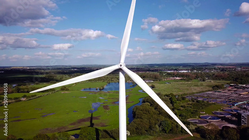 Wind turbine and agricultural fields in summer day, Energy Production, drone aerial view