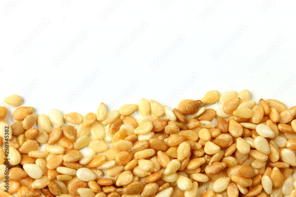 Sesame seeds isolated on white background, top view Sesame seeds isolated on white background, top view