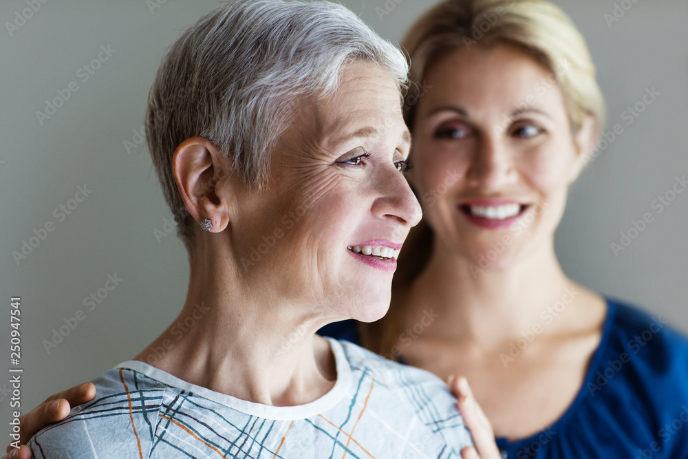 Smiling woman in hospital gown, Smiling woman in hospital gown,