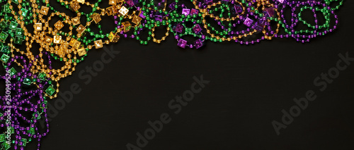 Fotografie, Obraz Purple, Gold, and Green Mardi Gras beads background