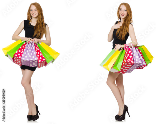 Young woman wth bags in shopaholic concept 