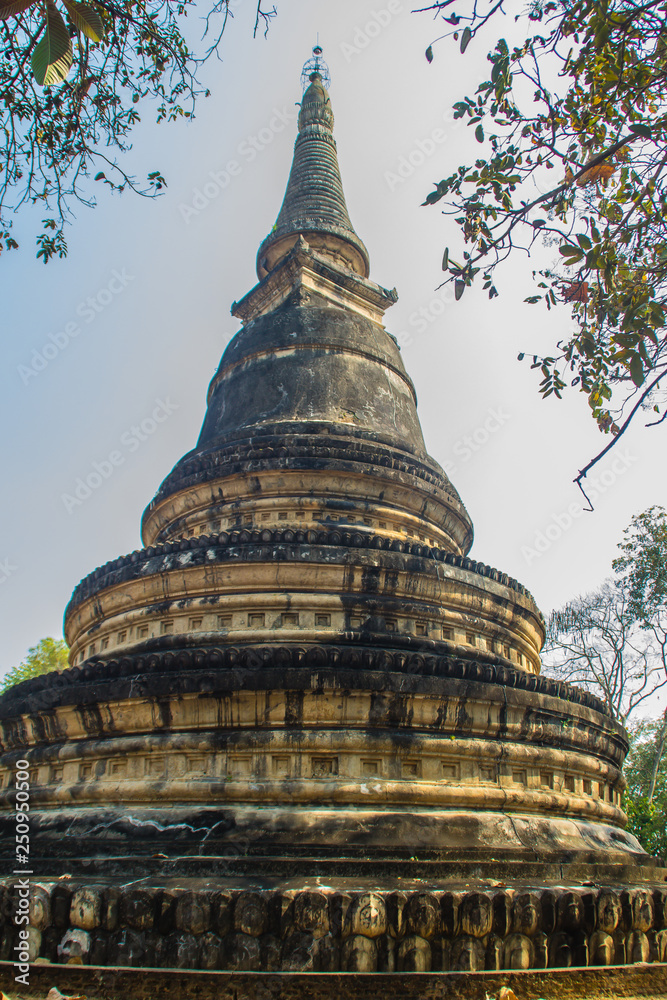 Ancient pagoda at Wat Umong Suan Puthatham, a 700-year-old Buddhist temple in Chiang Mai, Thailand. Wat Umong is famous Buddhist temple, tourist can practice meditation and learn from the monks.