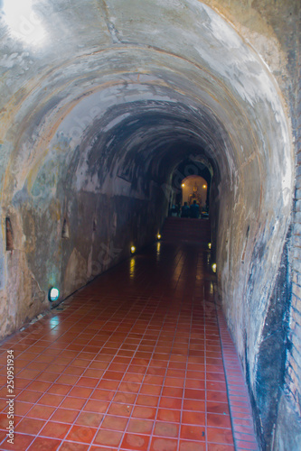 Amazing ancient tunnels at Wat Umong Suan Puthatham, a 700-year-old Buddhist temple in Chiang Mai, Thailand. The tunnels were supposedly built by the King Mangrai in 1297 and painted with bush scenes.