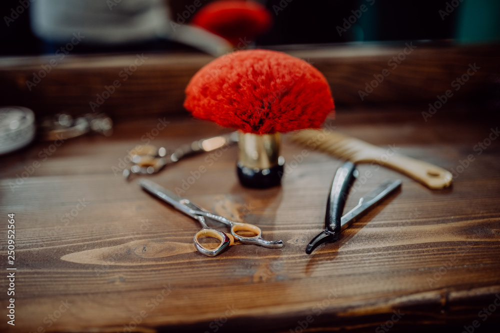 Barber shop tools on old wooden background