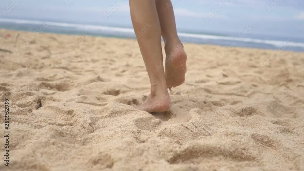 Happy cheerful woman having fun running to the sea Happy cheerful woman having fun running to the sea