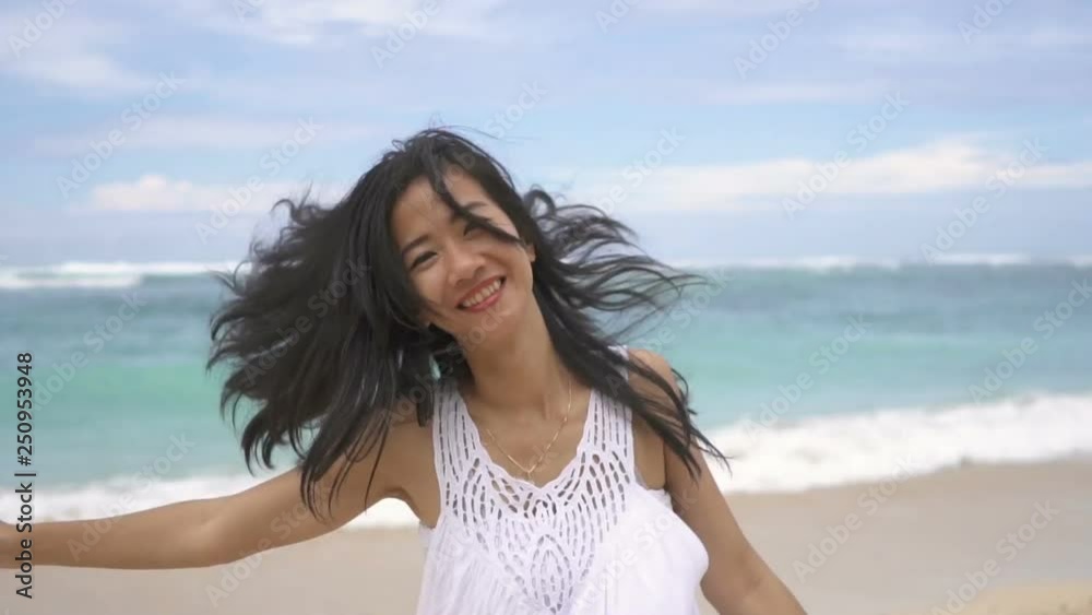 Happy cheerful woman having fun running to the sea Happy cheerful woman having fun running to the sea