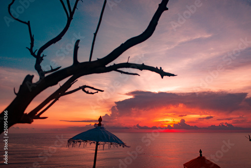 amazing scarlet sunset on beautiful tropical Bali beach