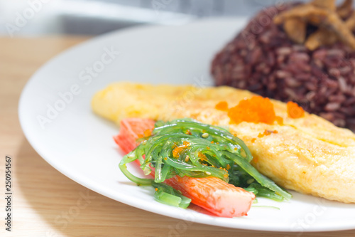 Rice with omelette on plate