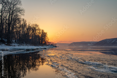 Melting ice on the river. Spring. Sunset in the Zhiguli mountains. © Nikolay Kartaev