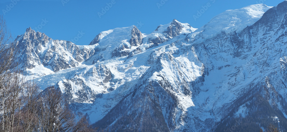 Amazing landscape at the summits of the Mont Blanc range on the French side. Blue sky. Winter season