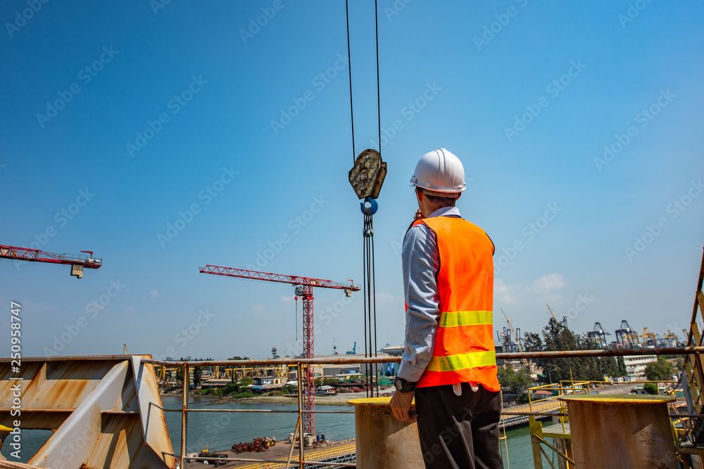 engineering foreman, loading master, controller in working place, command works in high level for safety and security method of regulation, works at risk in high workplace