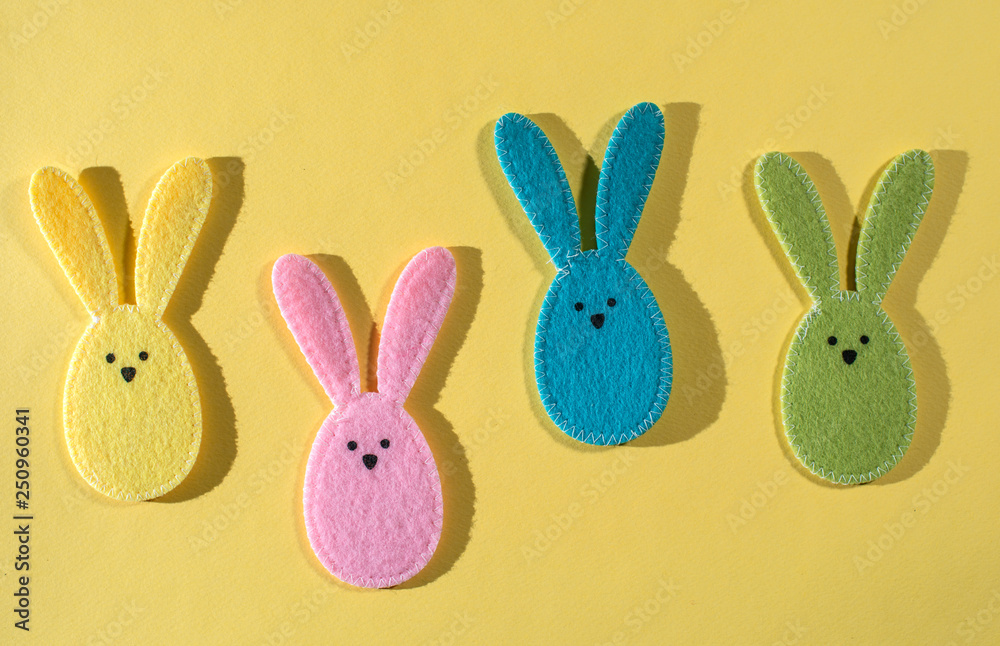 Obraz premium Easter bunnies on yellow background.