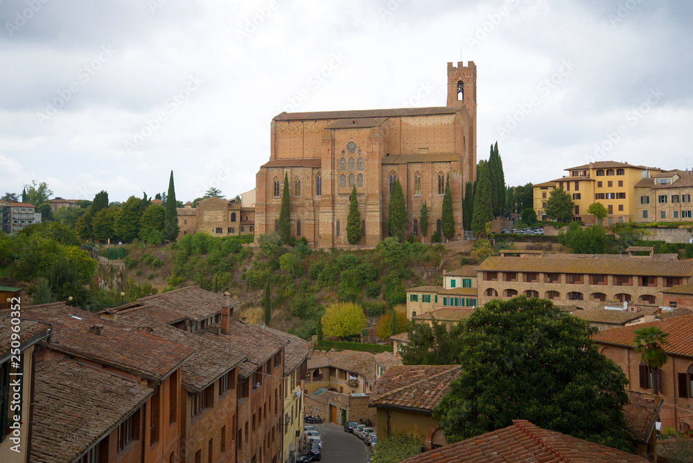 View of the Basilica of Cateriniana Di San Domenico on a cloudy September day. Siena, Italy