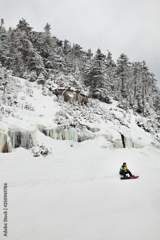 Snowboarder resting Snowboarder resting