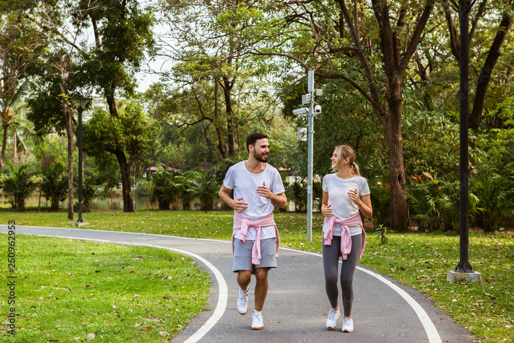 Young couple jogging and running in the park Young couple jogging and running in the park