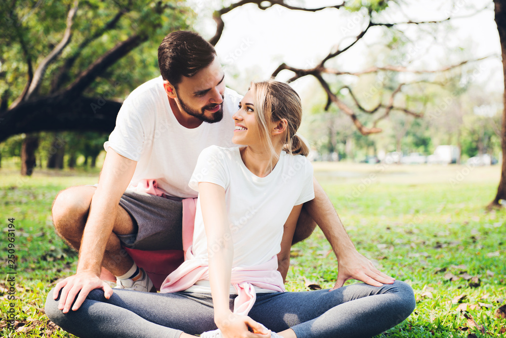 Young couple stretching before excercise Young couple stretching before excercise