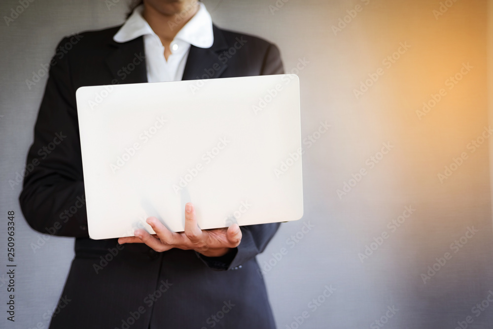 Business young woman using laptop at office. Business young woman using laptop at office.