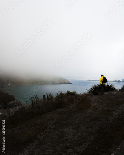 Yellow Jacket Man Fog Mountain Wallpaper