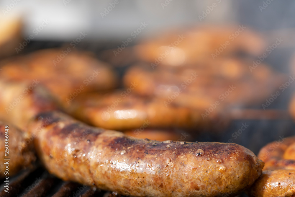Sausages Cooking Over The Hot Coals on Barbecue Grill