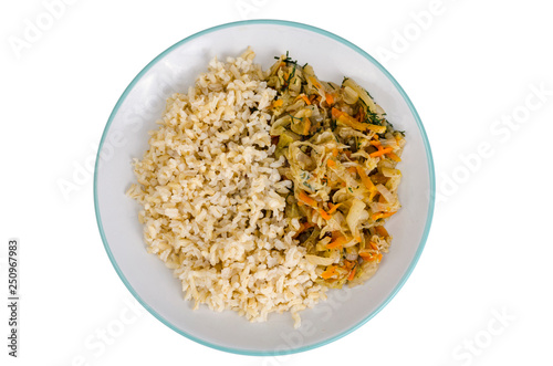Vegetarian healthy food. Braised cabbage with carrots, brown rice.