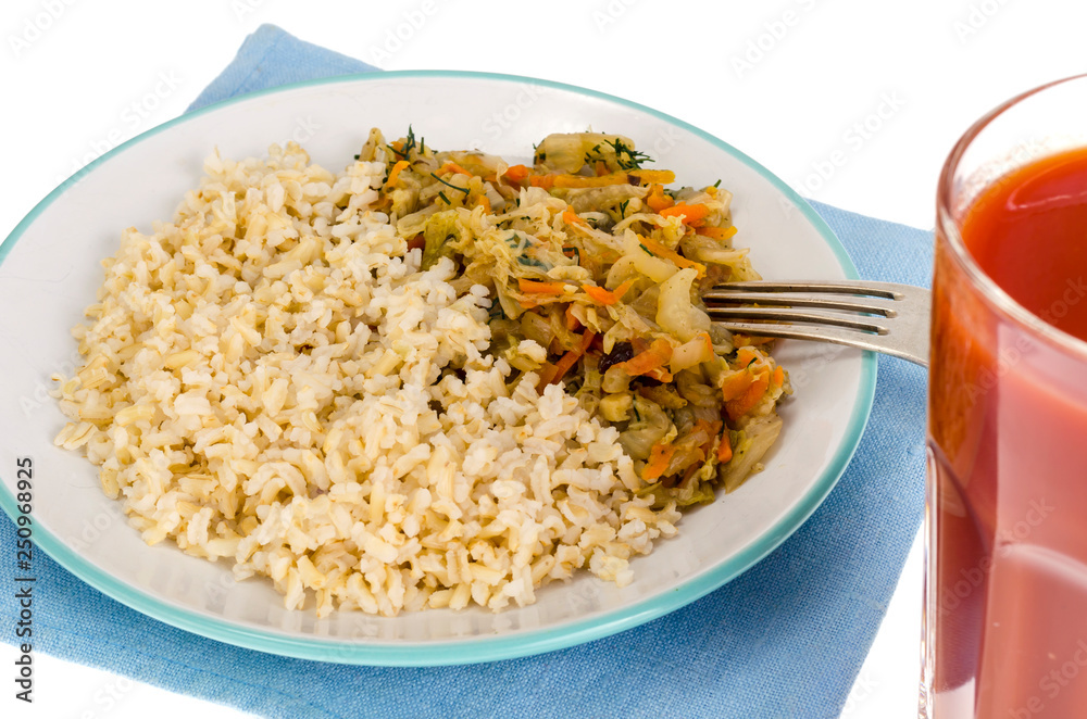 Vegetarian healthy food. Braised cabbage with carrots, brown rice. Vegetarian healthy food. Braised cabbage with carrots, brown rice.