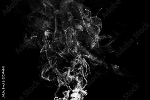 Smoke the white incense on a black background. darkness concept