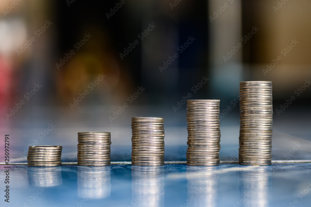 step of coins stacks, money, saving and investment or family planning concept. step of coins stacks, money, saving and investment or family planning concept.