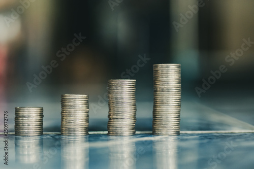 step of coins stacks, money, saving and investment or family planning concept.