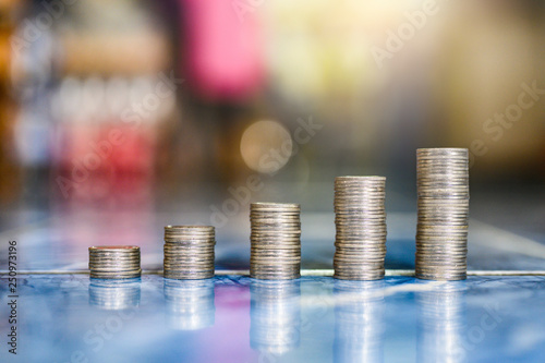 step of coins stacks, money, saving and investment or family planning concept.