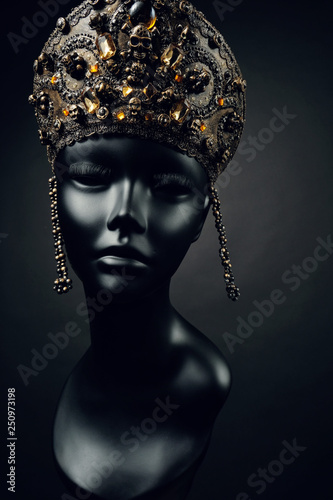 Mannequin head in creative metallic kokoshnick with skulls
